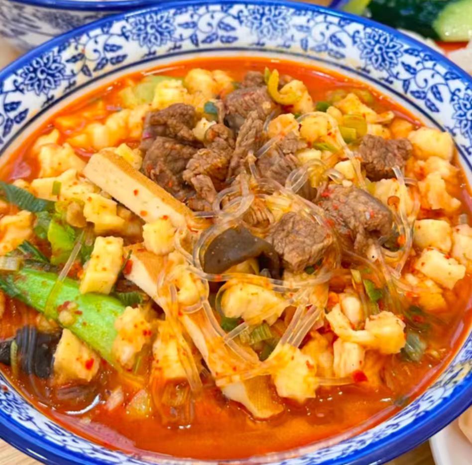 Tourists enjoying authentic mutton soup on private Xi’an tour.jpg