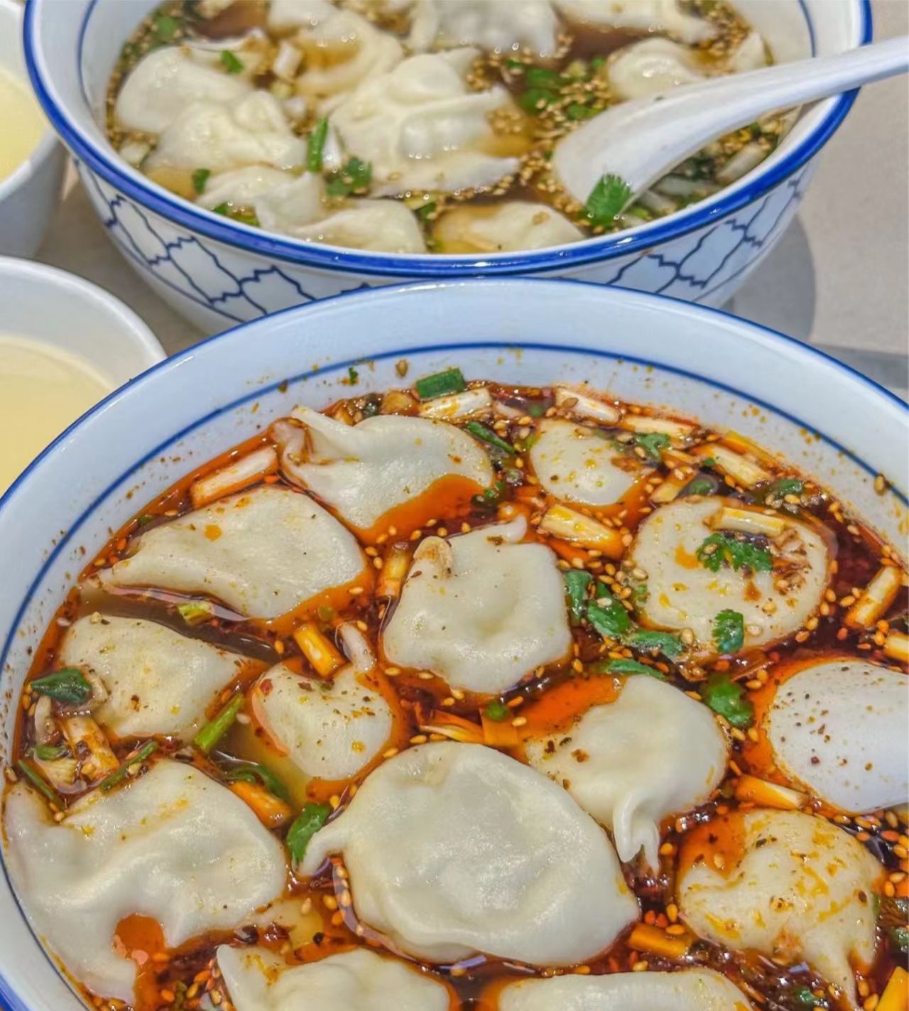 Steamed baozi buns and jiaozi dumplings commonly eaten by locals in Beijing.jpg